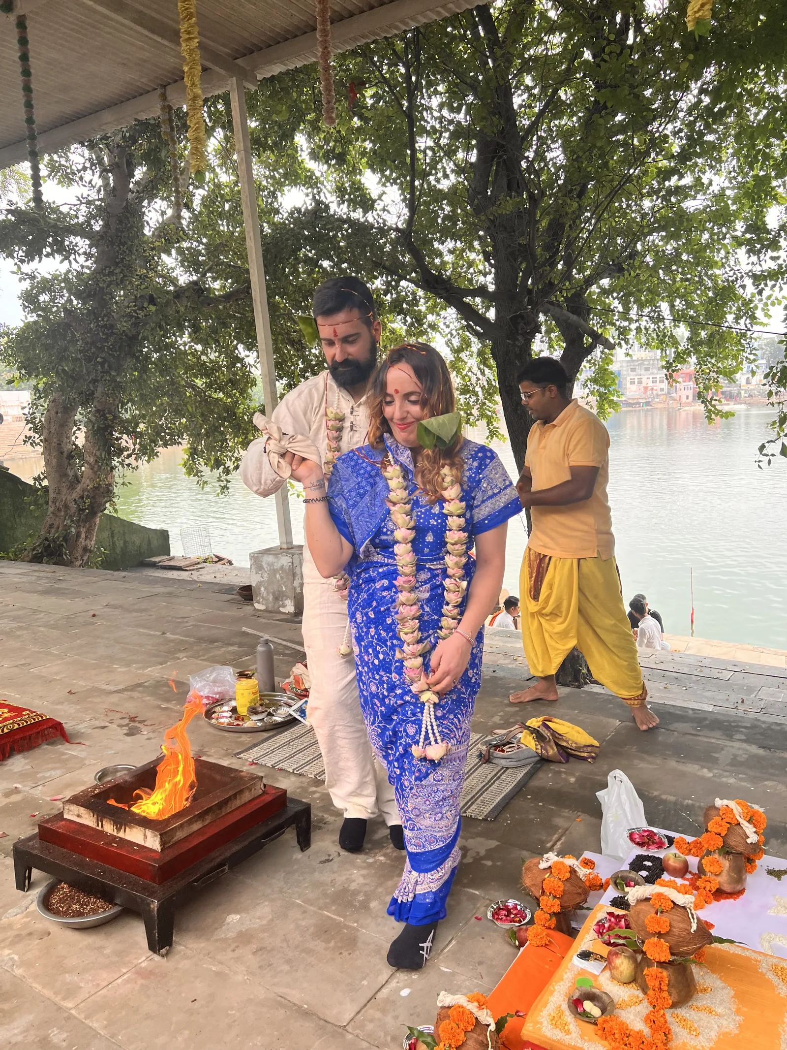 A couple take part in a Hindu wedding ritual by Pushkar Lake