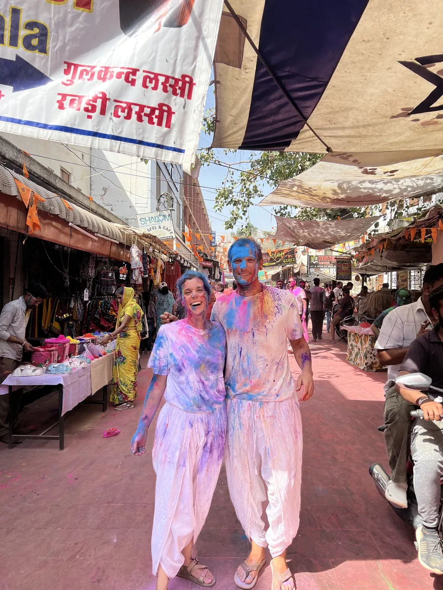 Visitors celebrate Holi in a colourful Pushkar street