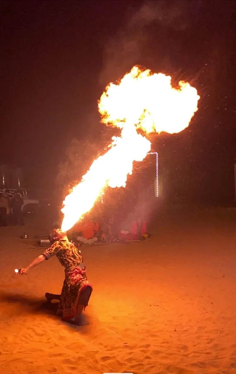 A traditional fire performance at a desert camp near Pushkar