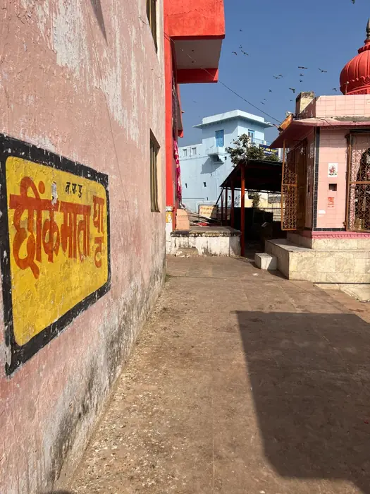 A dimly lit temple entrance in Pushkar
