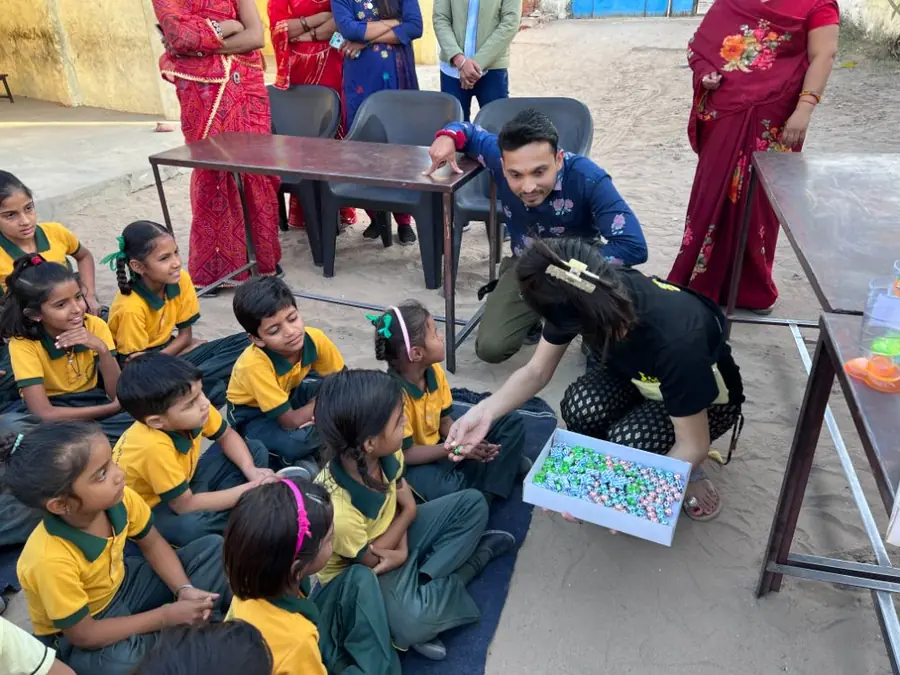 A visitor meets a village school class